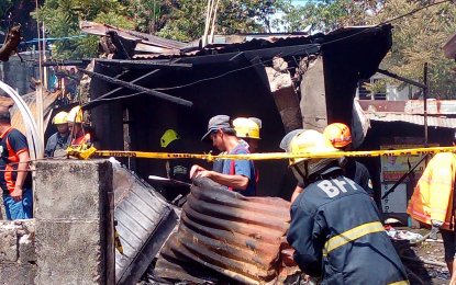 <p><strong>BURNED.</strong> Authorities sift through the burned rubble of the house in Purok 3, Barangay Lumang Bayan in Plaridel, Bulacan hit by the plane which crash landed on Saturday (March 17,2018). <em>(Photo by Manny Balbin)</em></p>